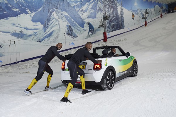 The trio pushed the MINI Convertible, wrapped in the unmissable colours of the Jamaican flag, up and down the snowy incline.